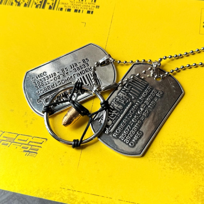 Cyberpunk Silverhand bullet necklace for gamers with metallic pendant