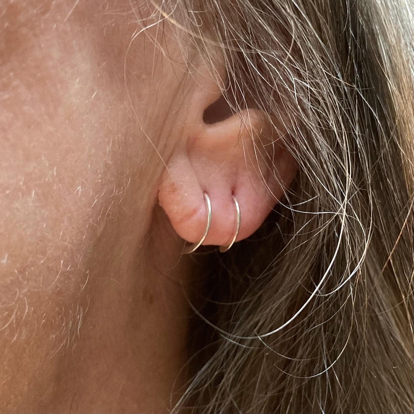 Hammered D sleeper earrings in 14k gold fill and Argentium silver minimalist half hoops