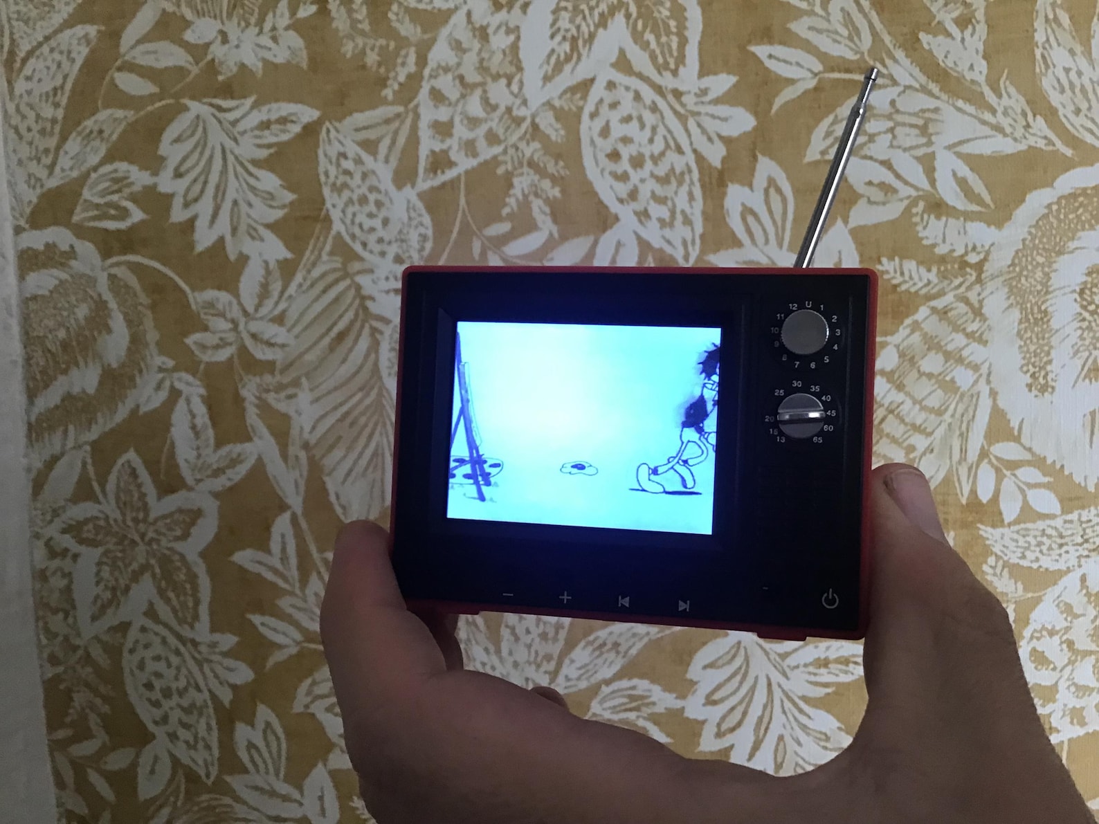 Mini retro TV video player with classic cartoon display