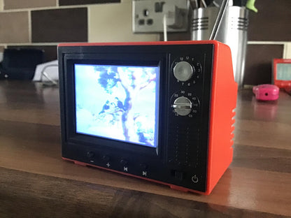 Mini retro TV video player with classic cartoon display