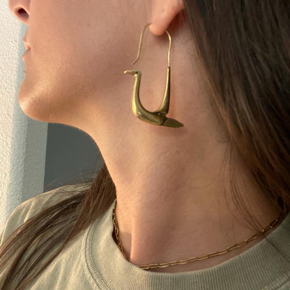 Handcrafted polished brass swan hoop earrings with sculptural bird design