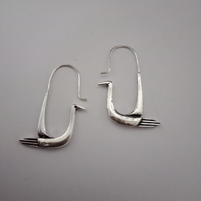 Handcrafted polished brass swan hoop earrings with sculptural bird design