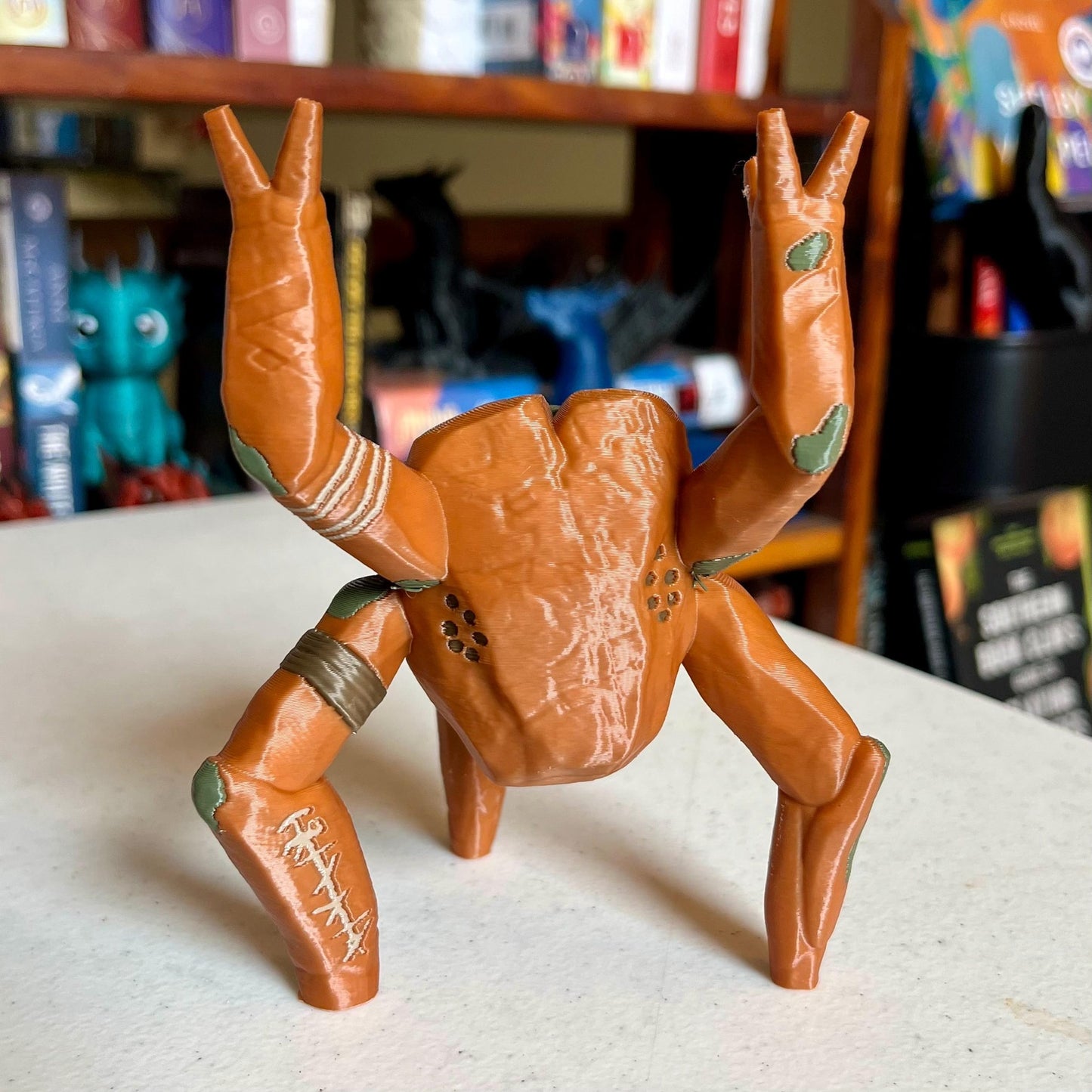 3D printed Rocky the Alien pen holder figure on a desk