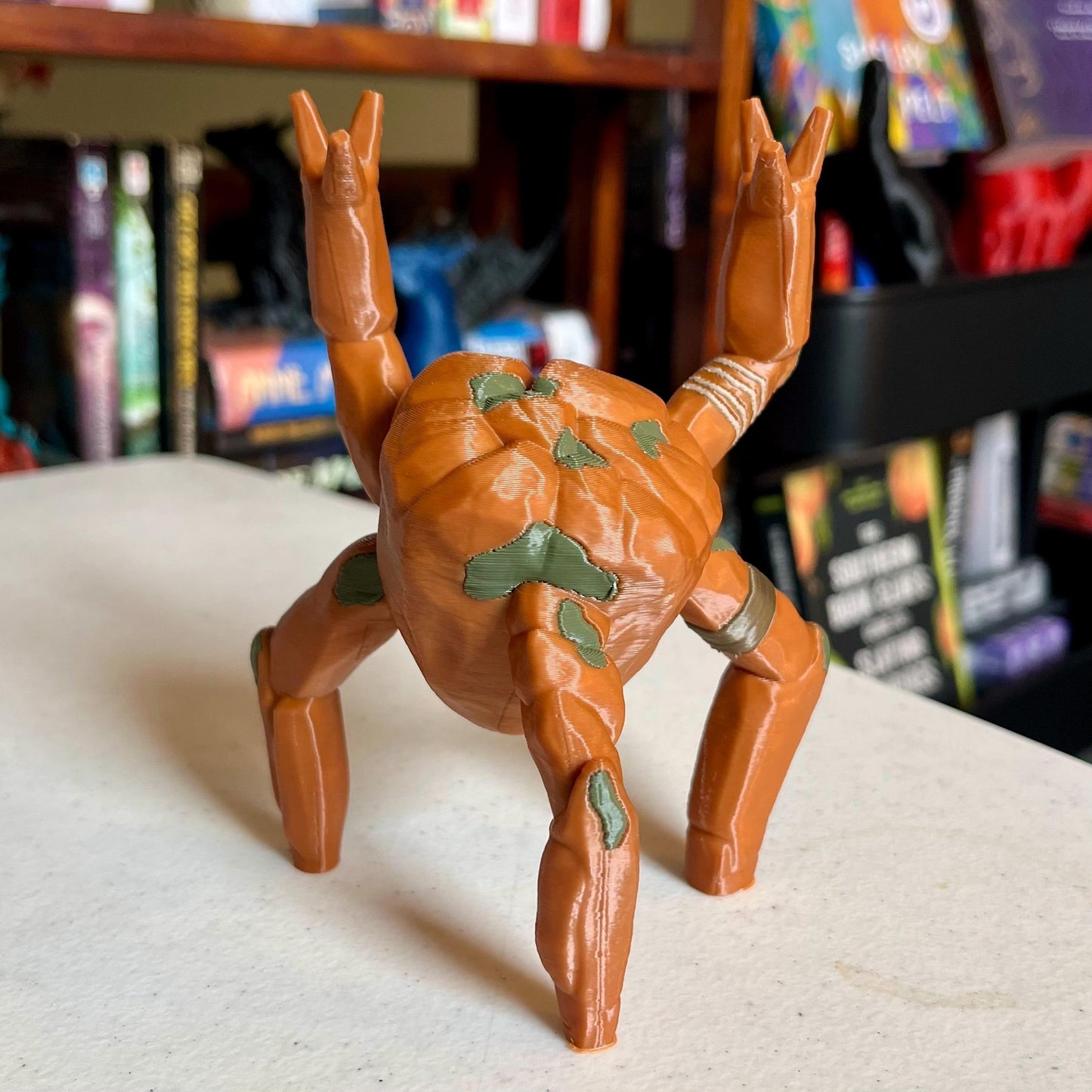3D printed Rocky the Alien pen holder figure on a desk