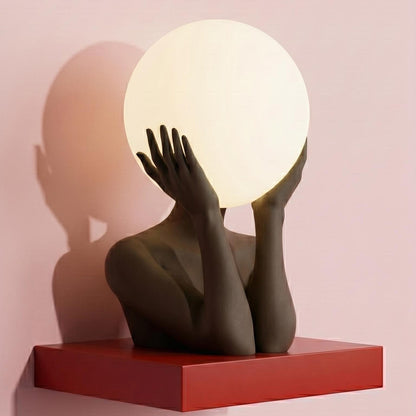 Sculptural sphere table lamp with modern ambient lighting for minimalist bedside decor