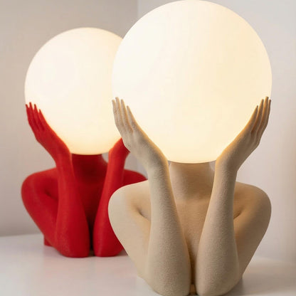 Sculptural sphere table lamp with modern ambient lighting for minimalist bedside decor
