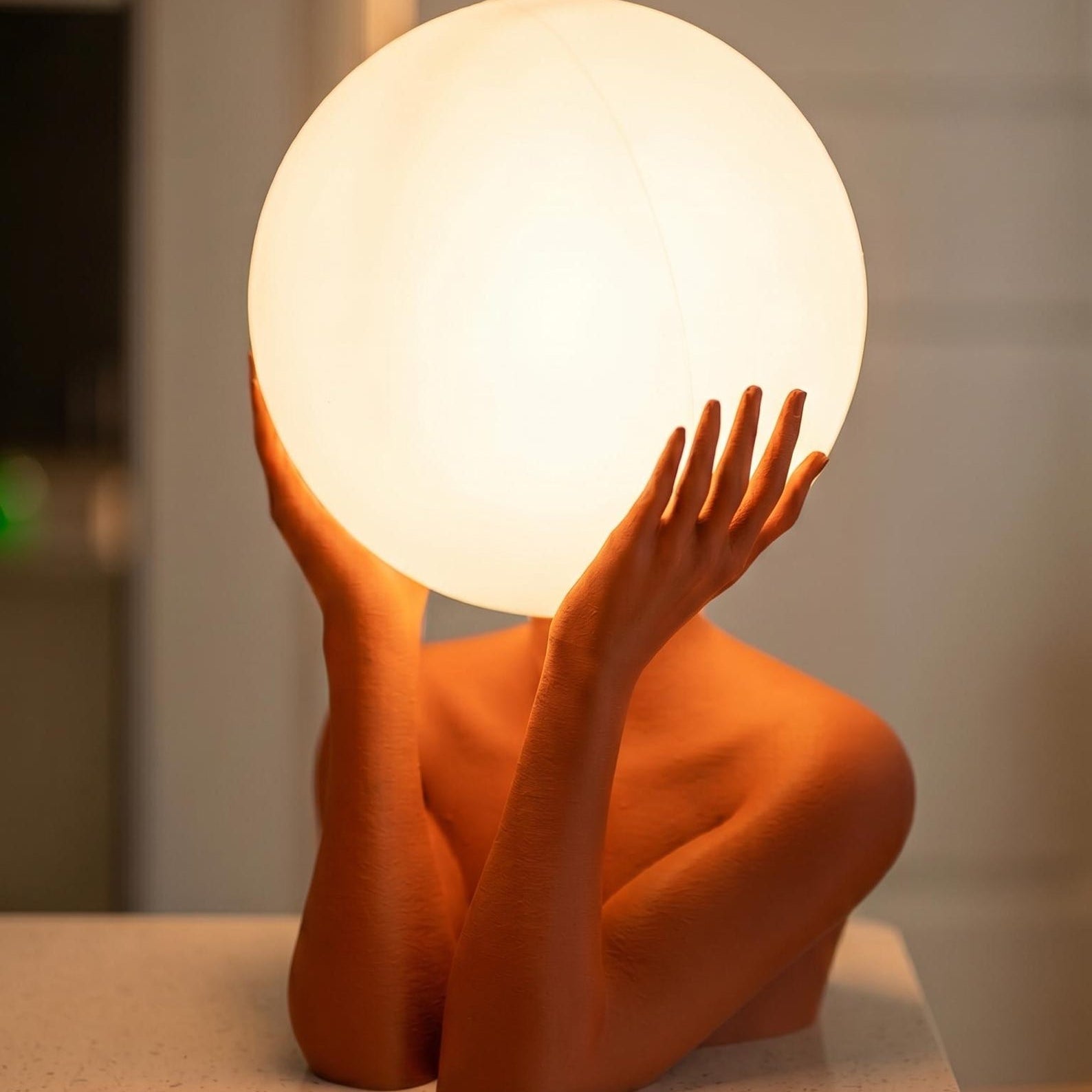 Sculptural sphere table lamp with modern ambient lighting for minimalist bedside decor