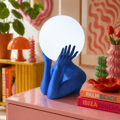 Sculptural sphere table lamp with modern ambient lighting for minimalist bedside decor